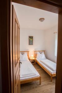 Posteľ alebo postele v izbe v ubytovaní Döre Vendégház