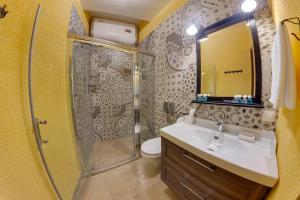 a bathroom with a shower and a sink at Apartment City in Saint Petersburg