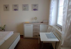 Giường trong phòng chung tại Hotel Gregor