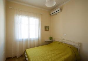 A bed or beds in a room at Oikia Preveza