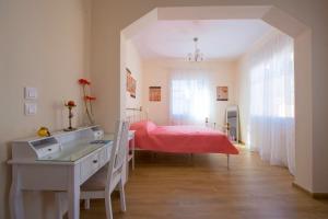 A bed or beds in a room at Oikia Preveza