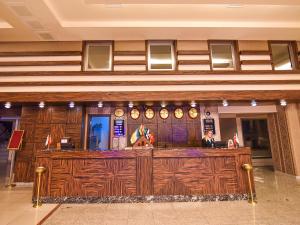 a bar in a lobby with wood paneling at Saylamlar Hotel in Trabzon +37 photos