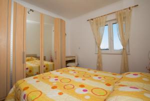a bedroom with two beds and a window at Apartments Silence in Mlini