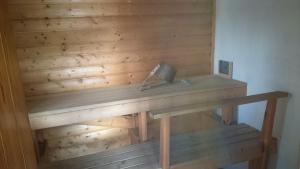 a wooden wall with a desk in a room at Lohja Chalet at Lake Enäjärvi in Karjalohja