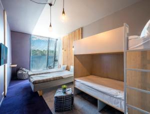 Cama ou camas em um quarto em Urbihop Hotel