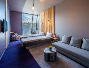 Cama ou camas em um quarto em Urbihop Hotel