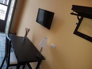 TV a/nebo společenská místnost v ubytování Central Suites Catania