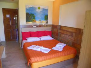 Ένα ή περισσότερα κρεβάτια σε δωμάτιο στο Mirabelle Hotel