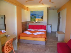 Ένα ή περισσότερα κρεβάτια σε δωμάτιο στο Mirabelle Hotel