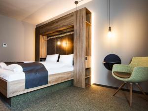 Postel nebo postele na pokoji v ubytování RiKu HOTEL Ulm