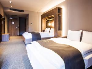 Postel nebo postele na pokoji v ubytování RiKu HOTEL Ulm