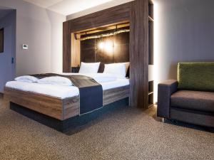 Postel nebo postele na pokoji v ubytování RiKu HOTEL Ulm