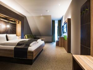 Postel nebo postele na pokoji v ubytování RiKu HOTEL Ulm