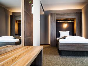 Postel nebo postele na pokoji v ubytování RiKu HOTEL Ulm