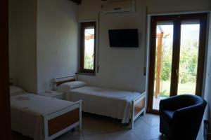Postel nebo postele na pokoji v ubytování Hotel Maremonti