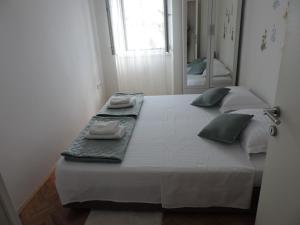 Posteľ alebo postele v izbe v ubytovaní Apartments Nina Riva