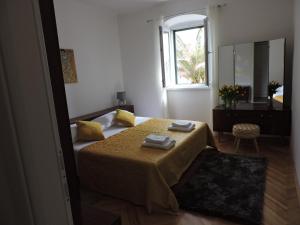 Posteľ alebo postele v izbe v ubytovaní Apartments Nina Riva