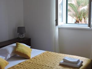 Posteľ alebo postele v izbe v ubytovaní Apartments Nina Riva