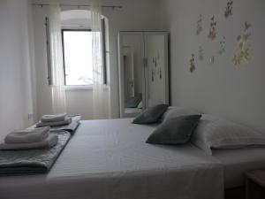 Posteľ alebo postele v izbe v ubytovaní Apartments Nina Riva