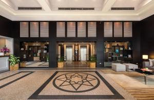 a lobby of a building with a star on the floor at Somerset Vientiane in Vientiane