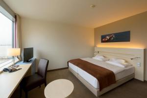 Ein Bett oder Betten in einem Zimmer der Unterkunft Atlantic Hotel Sail City