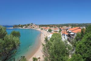 a view of a beach with people in the water at Hotel Korakakis Beach in Finikounta