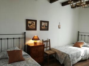 Postel nebo postele na pokoji v ubytování Los Canarios + 9 fotografií