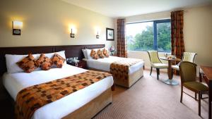Voodi või voodid majutusasutuse Kiltimagh Park Hotel toas