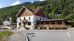 a large building on the side of a street at chalet des cyclistes in La Bresse