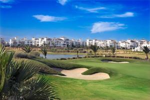 a view of the golf course at the resort at Casa La Torre in Roldán