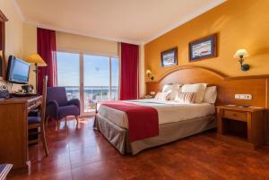 Postel nebo postele na pokoji v ubytování Hotel Isabel