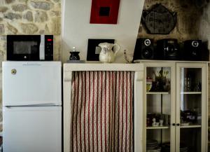 Kuchyň nebo kuchyňský kout v ubytování Le Duplex de Lapparan