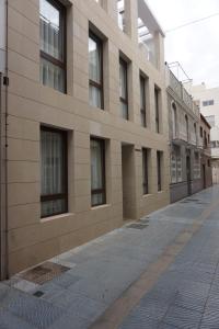 an empty street in front of a building at Rincon 13 - Mares in Torre del Mar