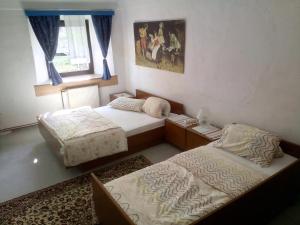 Postel nebo postele na pokoji v ubytování Guesthouse Veles