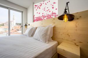 Llit o llits en una habitació de Hotel Santa Isabel