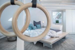 a bedroom with a bed and a large mirror at Design-Studiowohnung Haegestrasse in Gütersloh