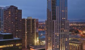 a view of a city at night with tall buildings at Four Seasons Hotel Denver in Denver