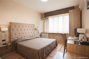 Postel nebo postele na pokoji v ubytování Hotel La Pace