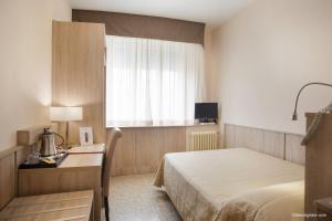 Postel nebo postele na pokoji v ubytování Hotel La Pace