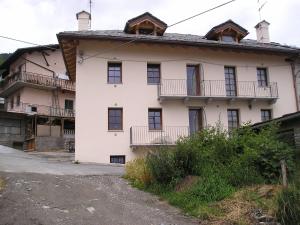 an old white house with windows and balconies at Planavilla in Doues +5 photos