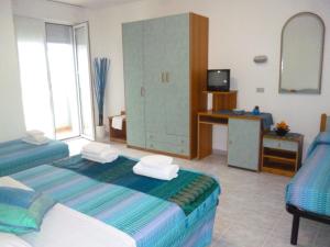 Postel nebo postele na pokoji v ubytování Residence BluAdria + 36 fotografií