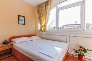 Posteľ alebo postele v izbe v ubytovaní Villa Mare Apartments