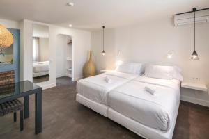 Tempat tidur dalam kamar di Costa d'Oiro Ambiance Village