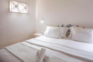 Tempat tidur dalam kamar di Costa d'Oiro Ambiance Village