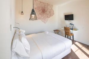 Tempat tidur dalam kamar di Costa d'Oiro Ambiance Village