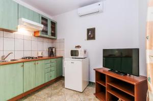 Kuchyňa alebo kuchynka v ubytovaní Villa Mare Apartments