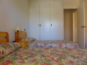 Posteľ alebo postele v izbe v ubytovaní Rentalmar Amanecer