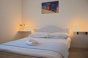 Postel nebo postele na pokoji v ubytování Apartments Jadranovo