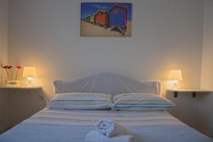 Postel nebo postele na pokoji v ubytování Apartments Jadranovo
