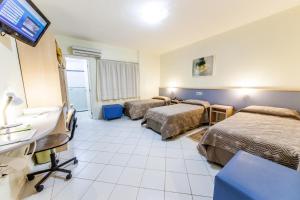 Uma cama ou camas num quarto em Asppen Hotel